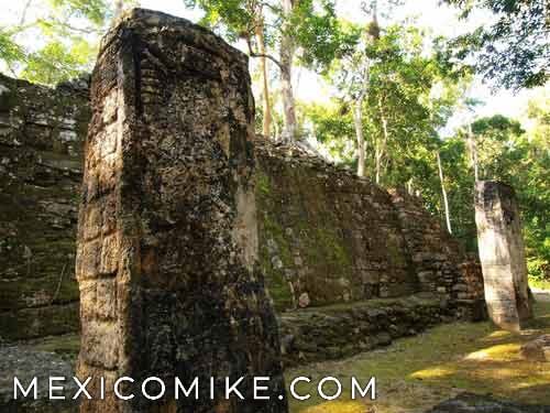 Carved stelae and stone walls at the ancient Mayan ruins of Calakmul
